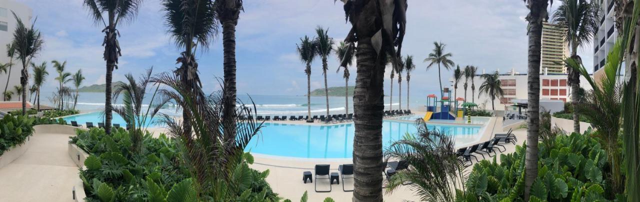 Viaggio Resort Mazatlan Exterior photo View of the beach at the Grand Palladium Hotel